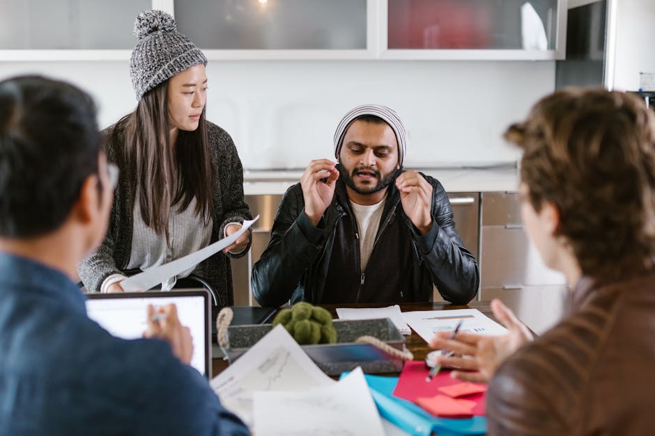A diverse and collaborative team brainstorming in a modern office.